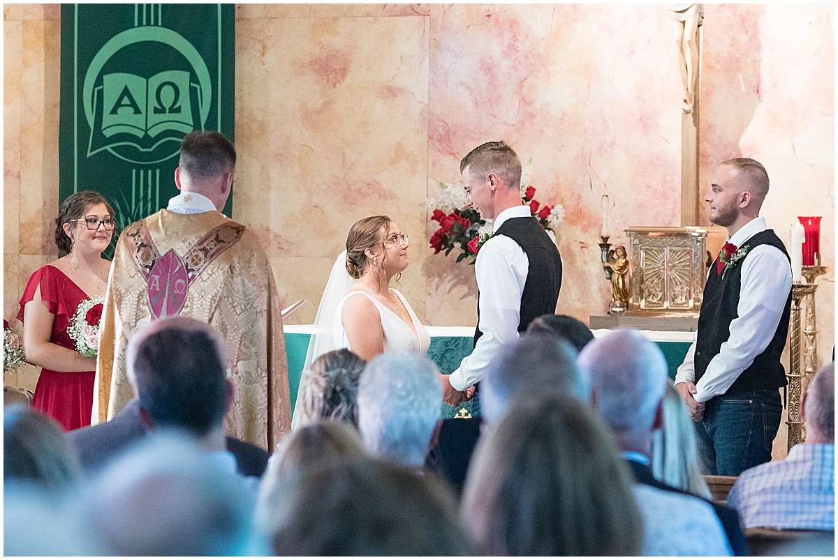 Bride and groom at alter for wedding ceremony at St. Augusta Catholic Church in Lake Village, Indiana