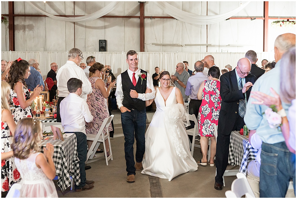 Grand entrance of couple at Churchill Farms wedding in Lake Village, Indiana