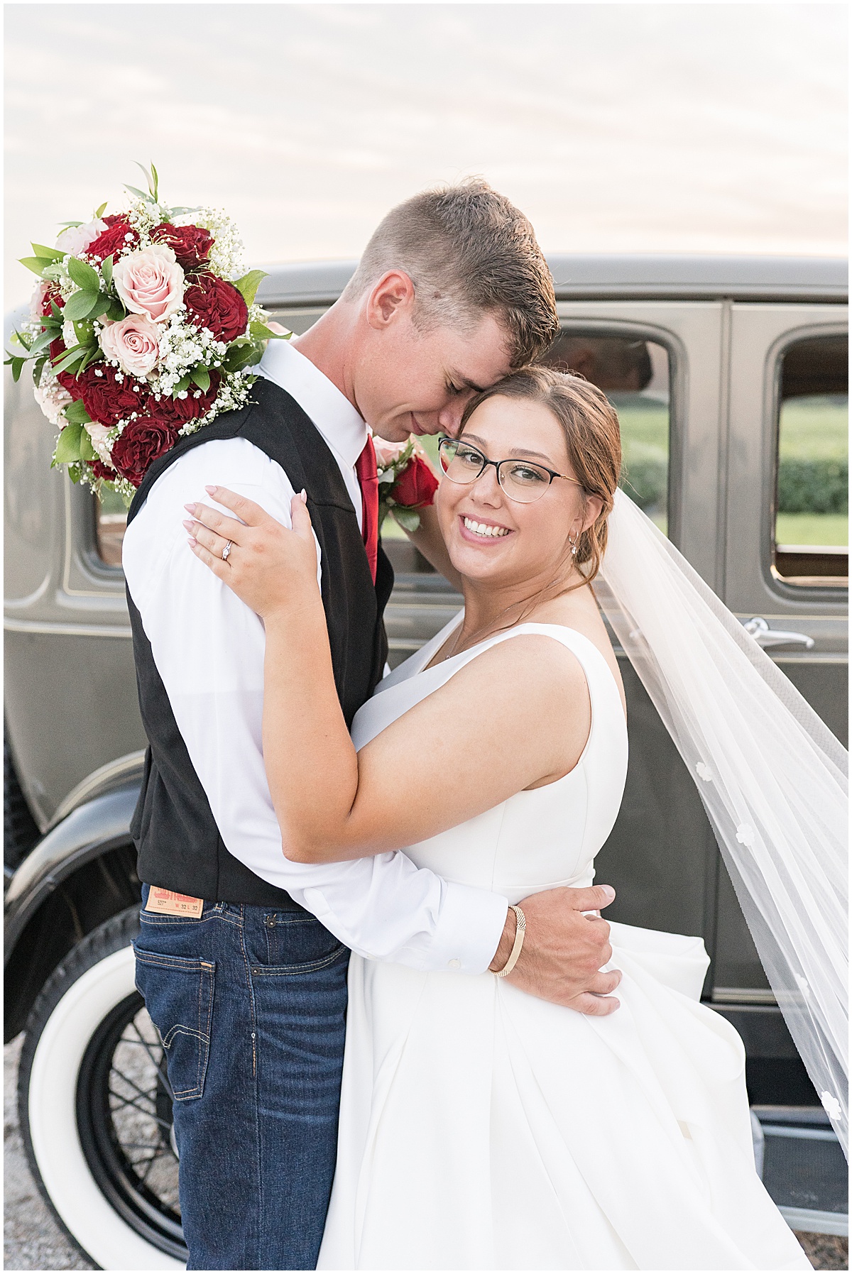 Bride and groom with vintage car after Churchill Farms wedding in Lake Village, Indiana
