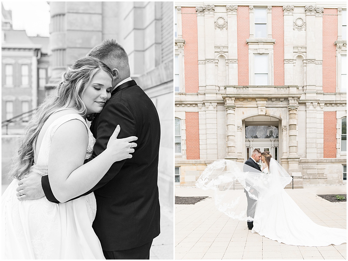 Bride and groom hug during wedding photos at Hamilton County Courthouse in downtown Noblesville, Indiana 