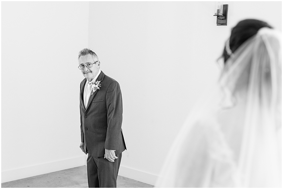 Father of the bride's first look reaction at pastel wedding at New Journey Farms in Lafayette, Indiana