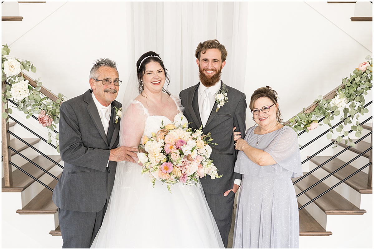 Portraits with family at pastel wedding at New Journey Farms in Lafayette, Indiana