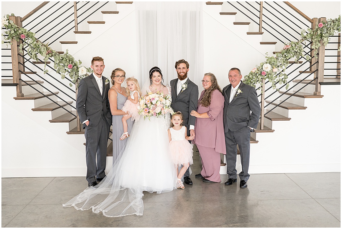 Portraits with family at pastel wedding at New Journey Farms in Lafayette, Indiana