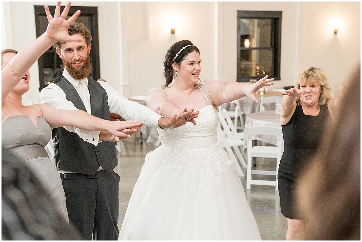 Reception dancing at pastel wedding at New Journey Farms in Lafayette, Indiana