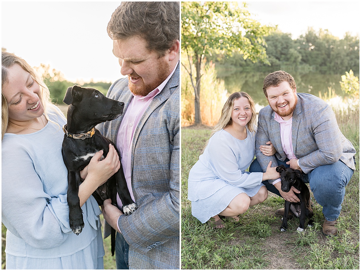 Couple holding black dog during summer engagement photos at Fairfield Lakes Park