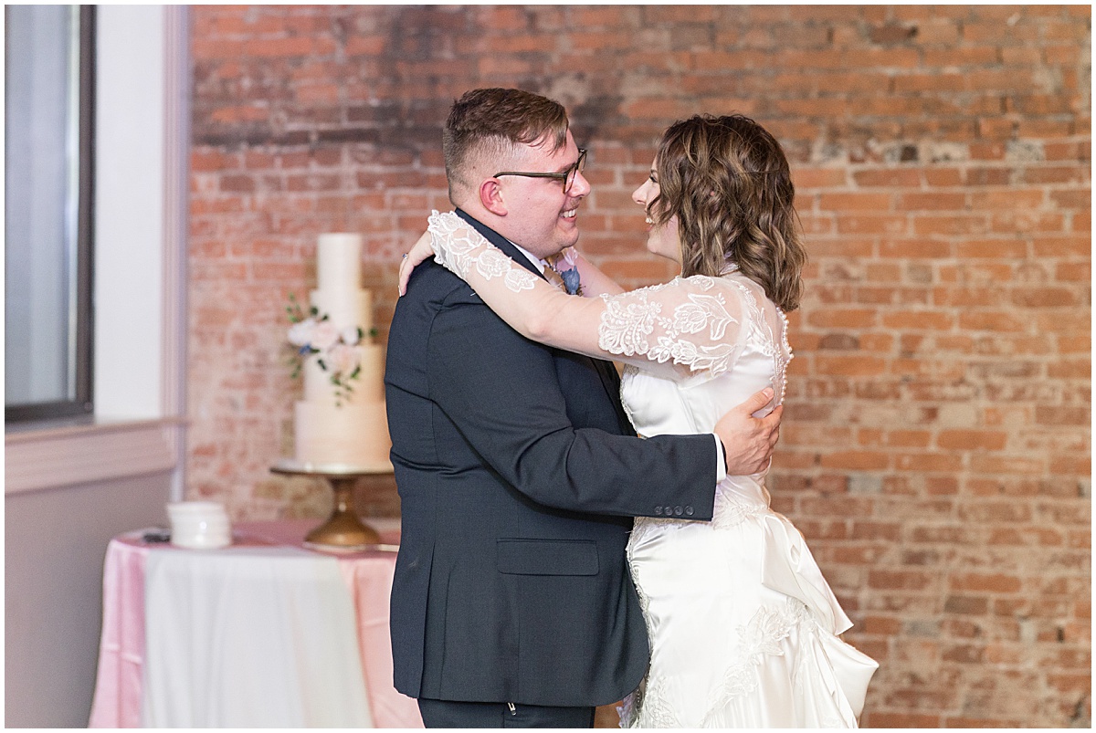 Bride and groom dancing at fall wedding at The Rat Pak Venue in Downtown Lafayette, Indiana