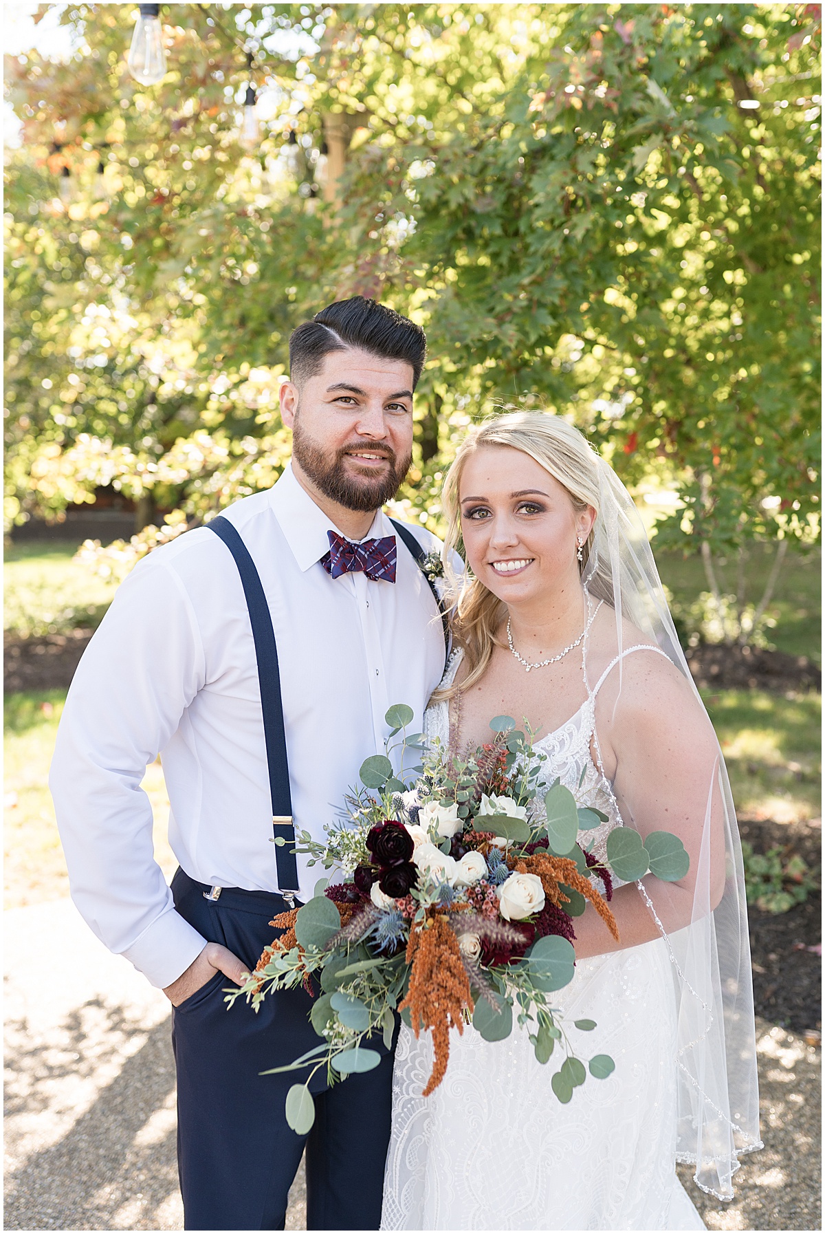 Bride and groom portrait under tree before Finley Creek Vineyards wedding in Zionsville, Indiana