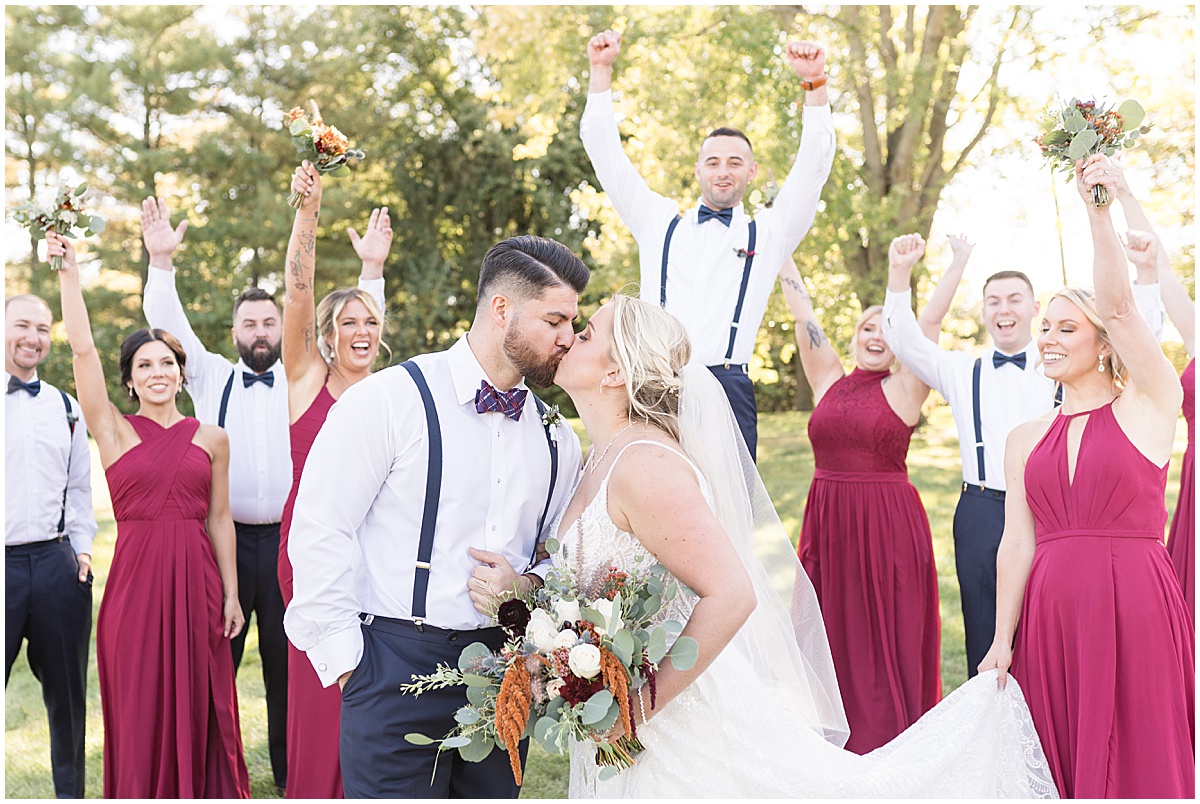 Bridal party cheers for couple at Finley Creek Vineyards wedding in Zionsville, Indiana