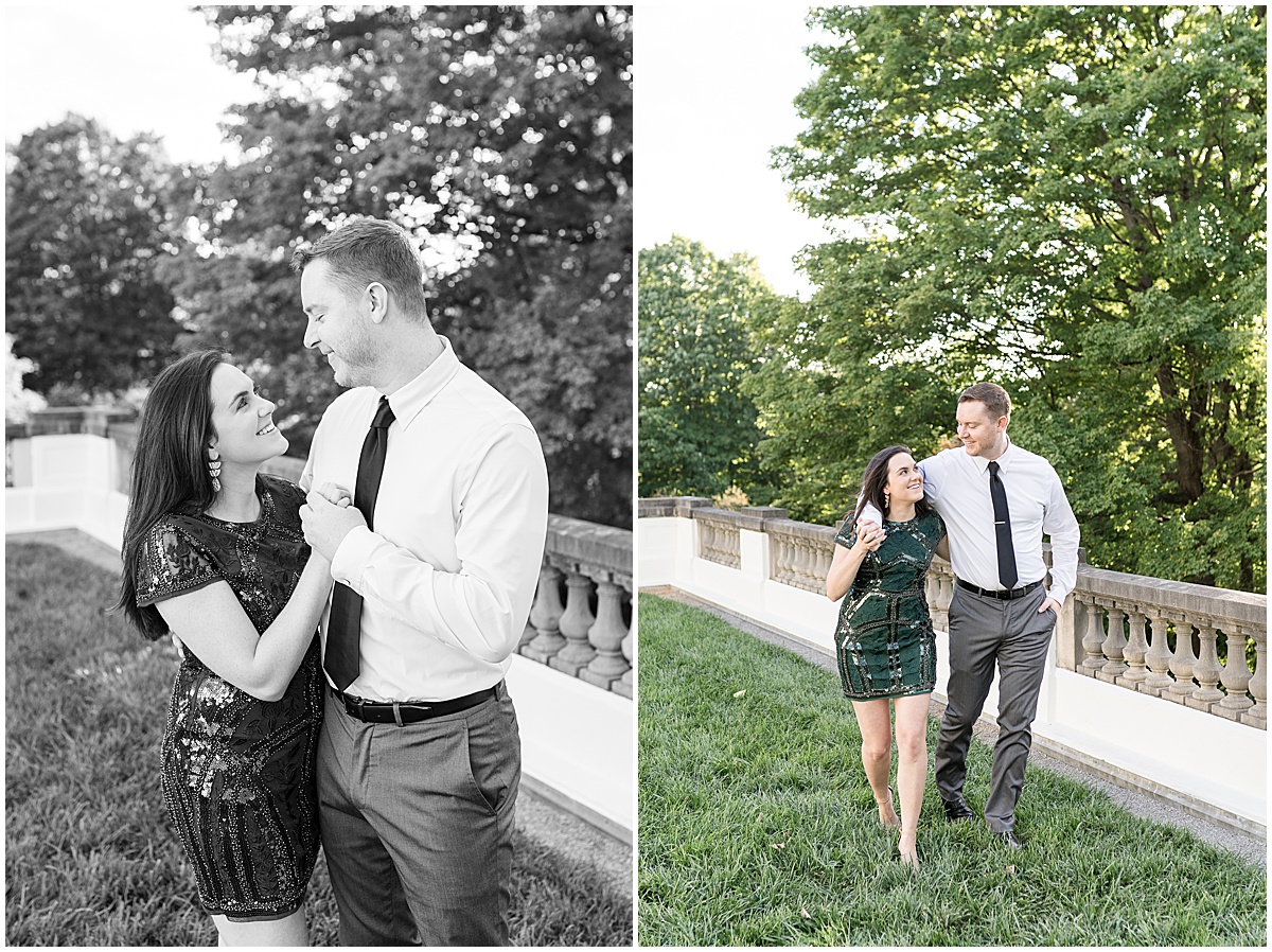 Couple walking in grass during jewel tone engagement photos at Newfields
