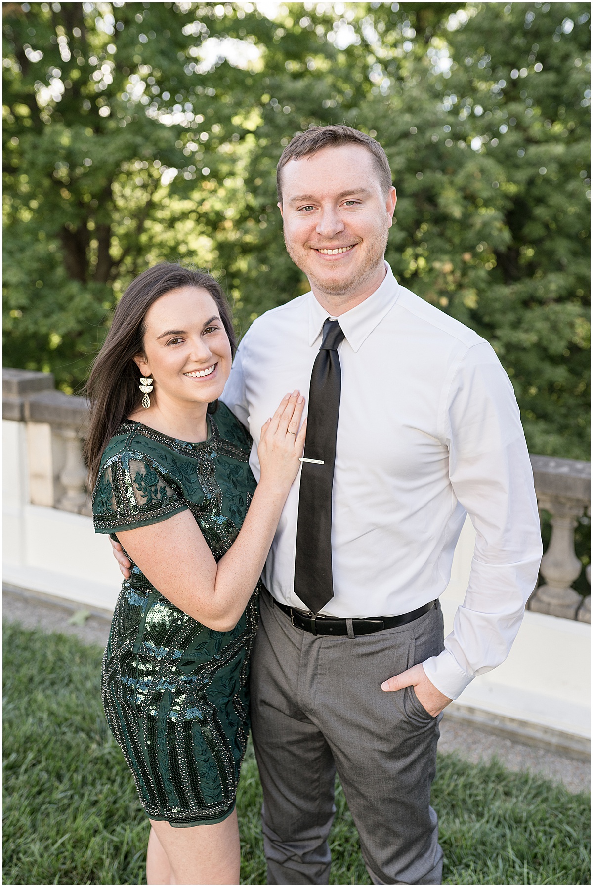 Bride to be wears green dress at jewel tone engagement photos at Newfields