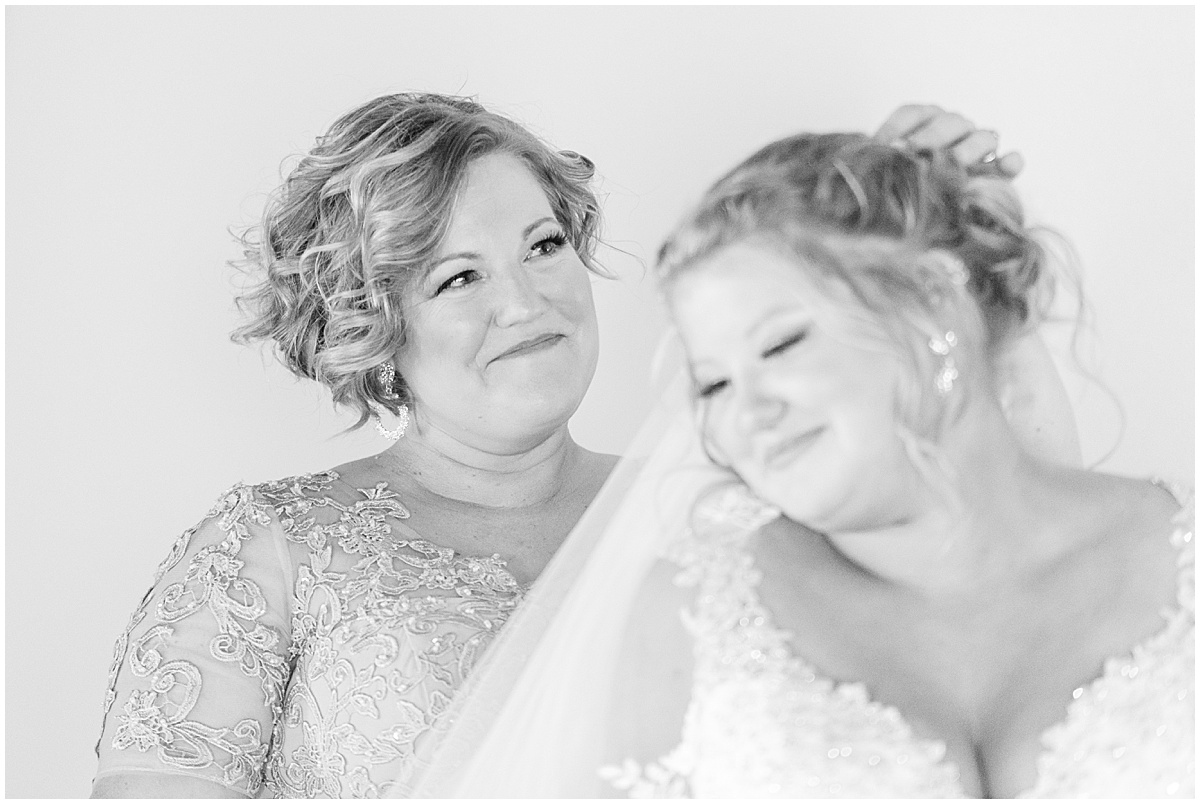 Mother of the bride admires daughter before Miami County Fairgrounds wedding in Peru, Indiana