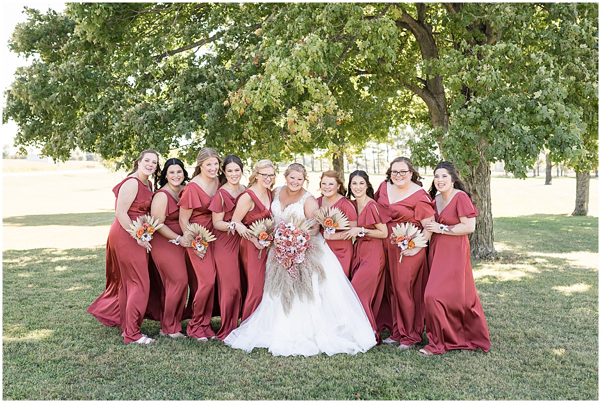 Bridesmaids huddle together before Miami County Fairgrounds wedding in Peru, Indiana
