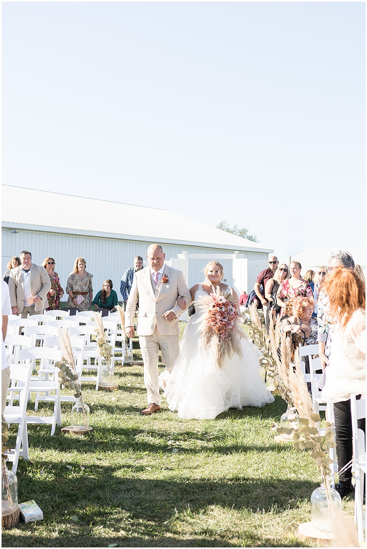 Bride walking down aisle at Miami County Fairgrounds wedding in Peru, Indiana