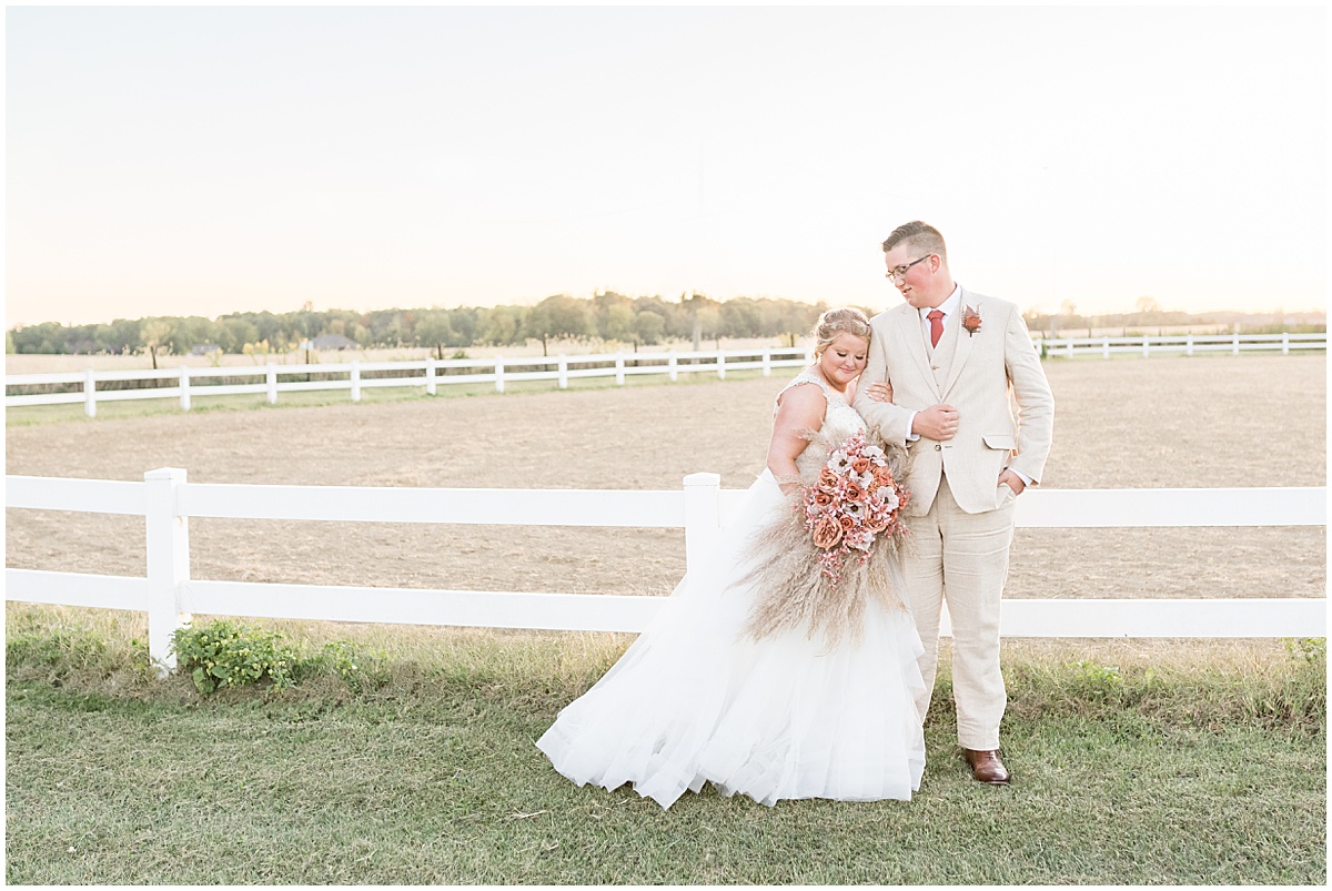 Newlyweds sunset photos after Miami County Fairgrounds wedding in Peru, Indiana