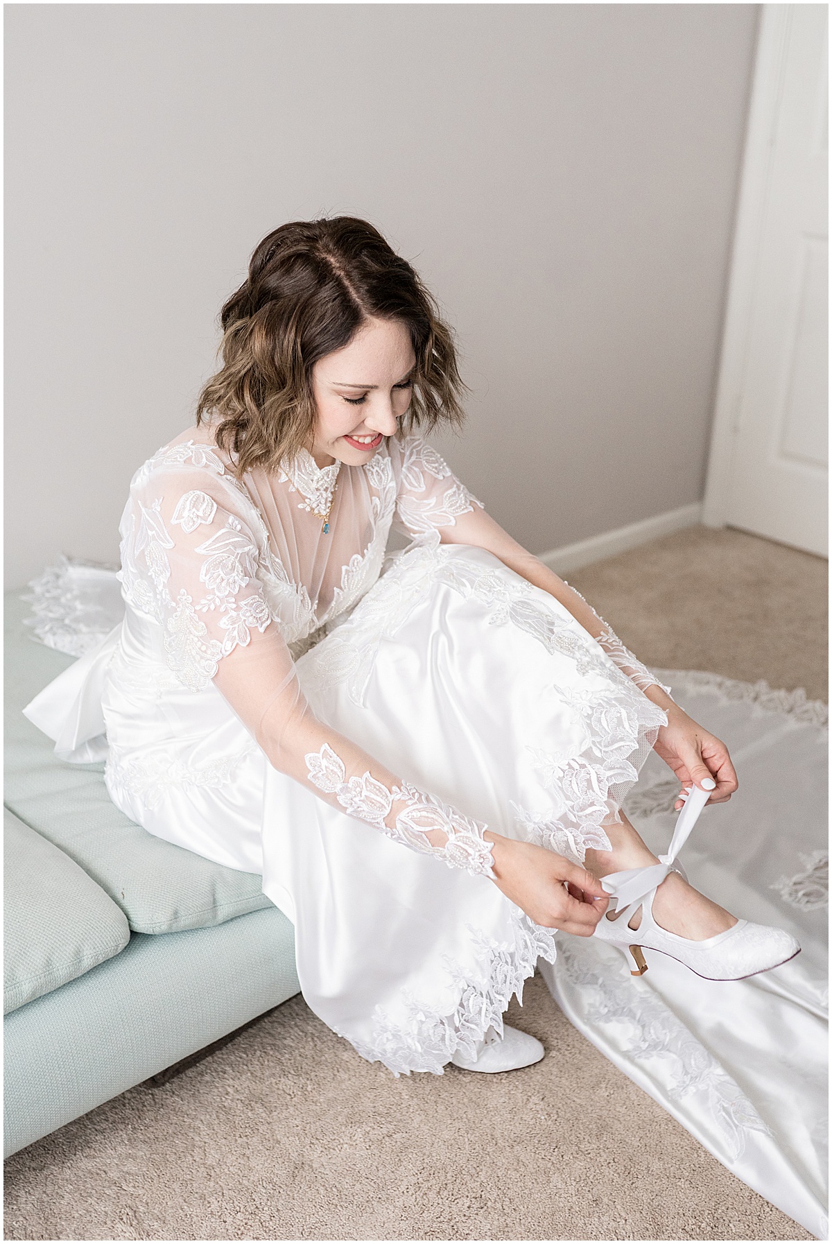 Bride putting on shoes with ribbon ties before wedding in Lafayette, Indiana