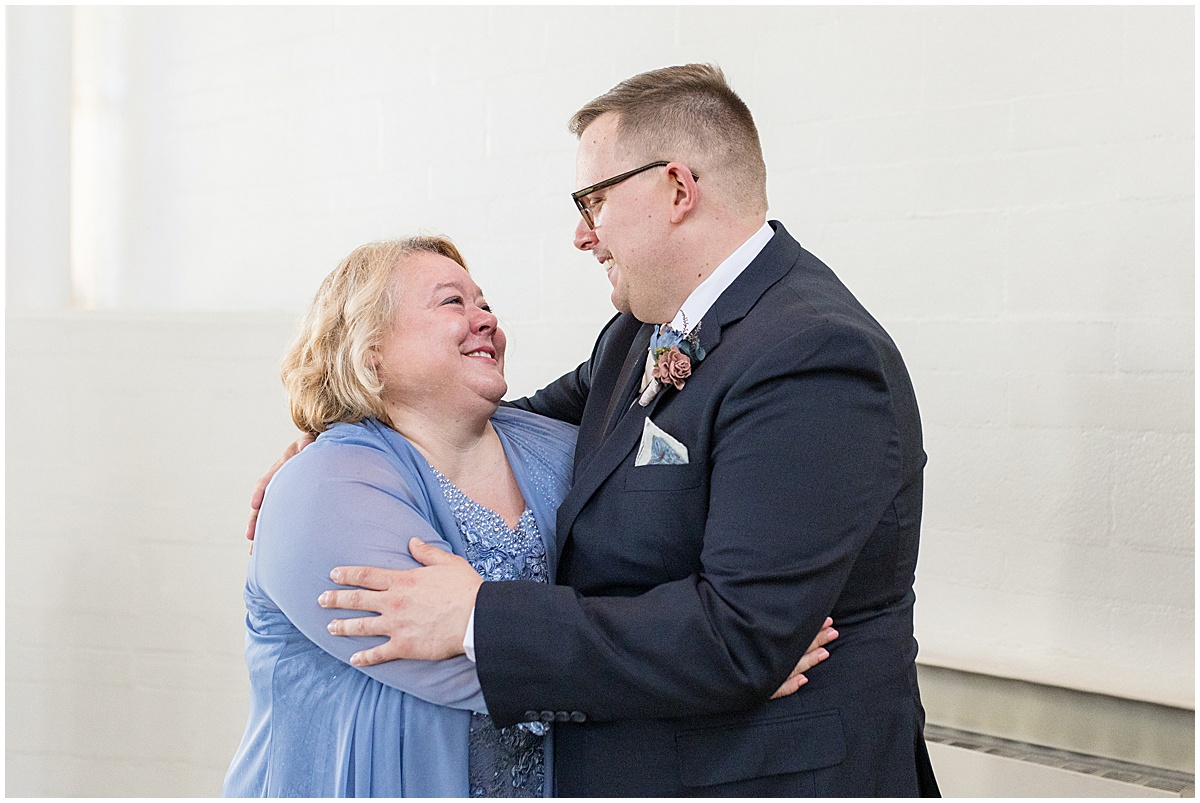 Groom hugging mother before wedding in Lafayette, Indiana