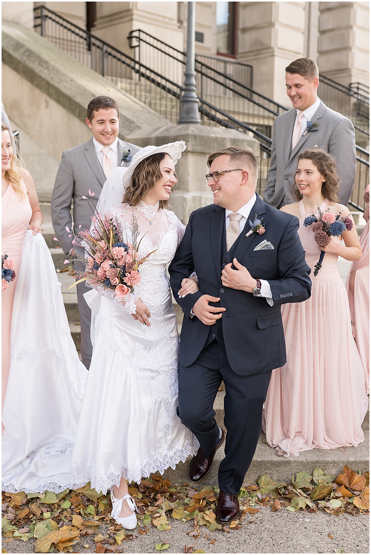 Bridal party walking during wedding photos in Downtown Lafayette, Indiana