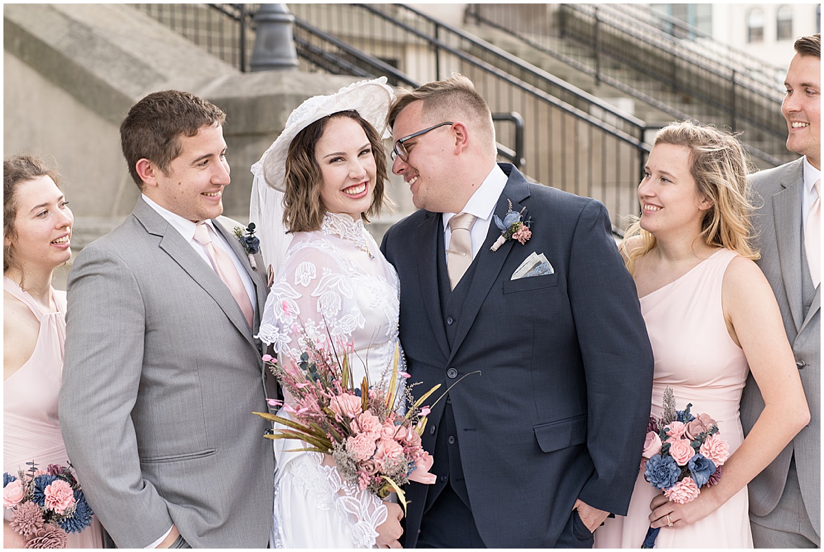 Bridal party laughs during wedding photos in Downtown Lafayette, Indiana