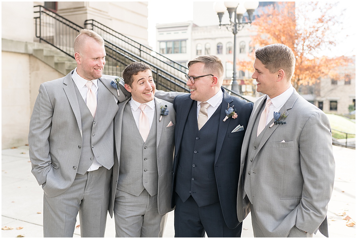 Groom and groomsmen at wedding photos in Downtown Lafayette, Indiana