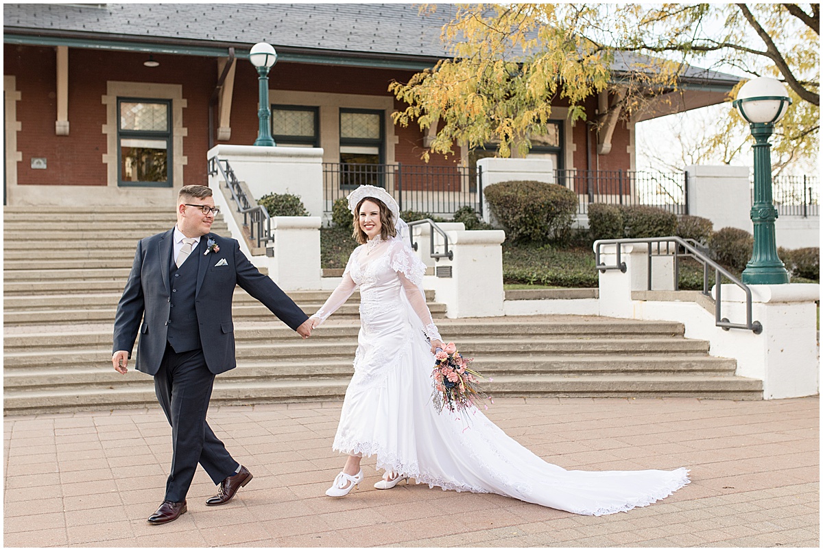 Bride and groom outside train station after wedding in Lafayette, Indiana