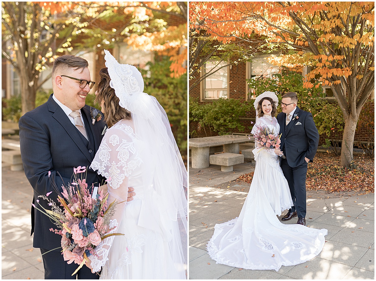 Bride and groom in fall leaves at wedding at St. Thomas Aquina Church in West Lafayette, Indiana