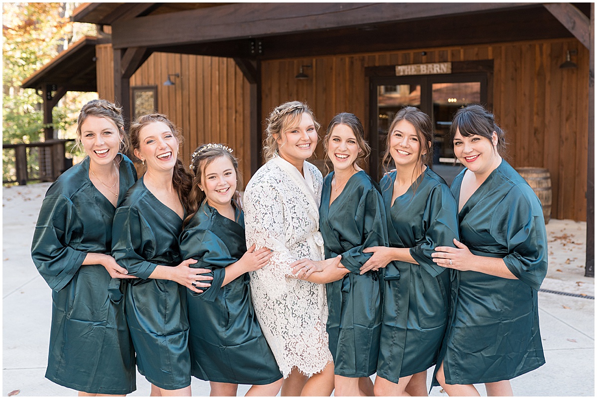 Bride and bridesmaids in robes before fall wedding at 3 Fat Labs in Greencastle, Indiana