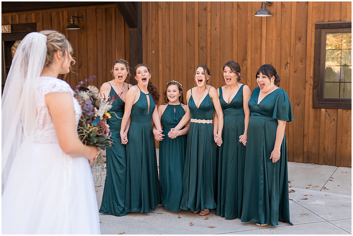 Bridesmaids reaction to bride before fall wedding at 3 Fat Labs in Greencastle, Indiana