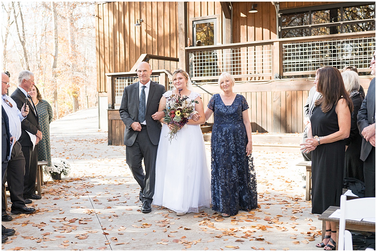 Bride walking down the aisle at fall wedding at 3 Fat Labs in Greencastle, Indiana