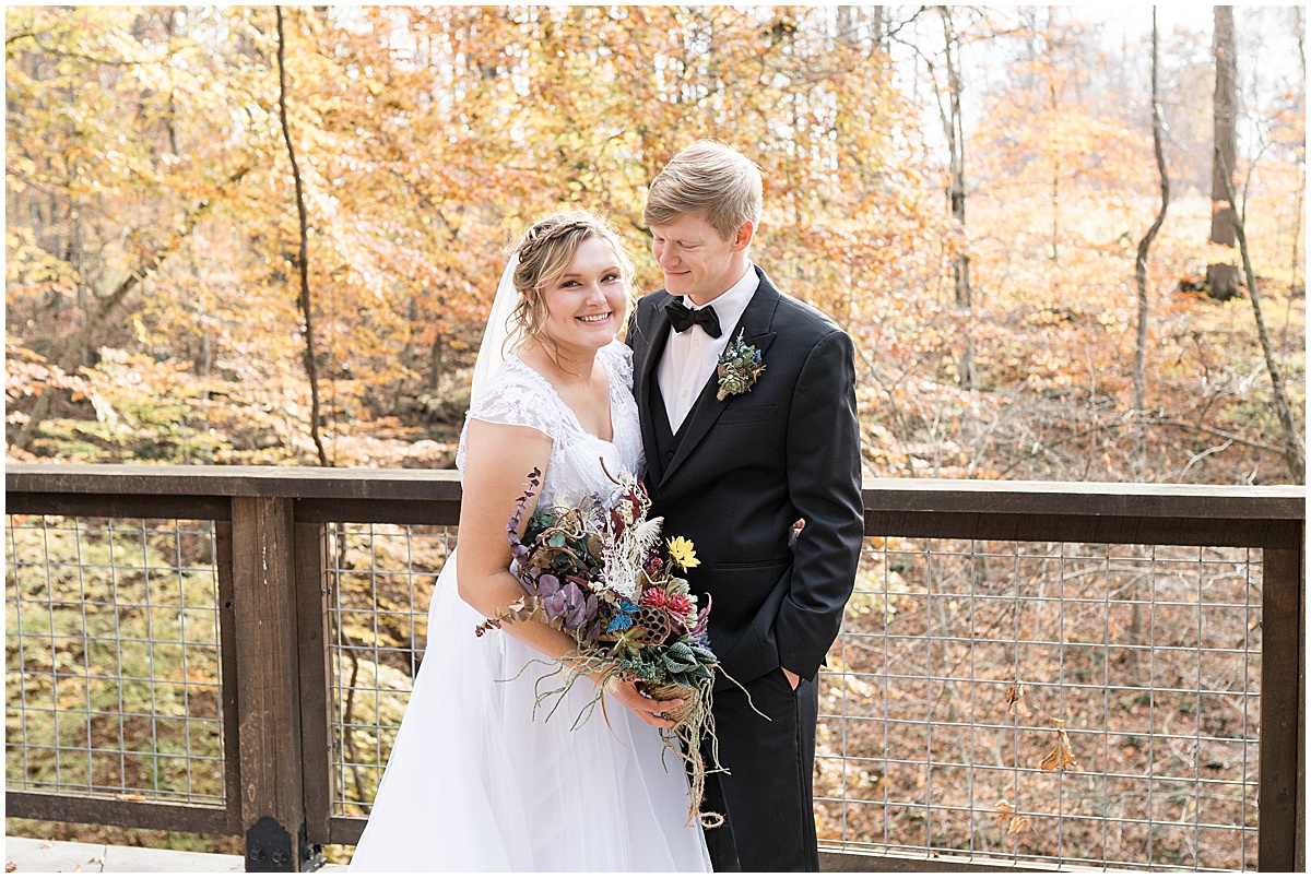 Bride and groom portrait in front of fall foliage at fall wedding at 3 Fat Labs in Greencastle, Indiana 