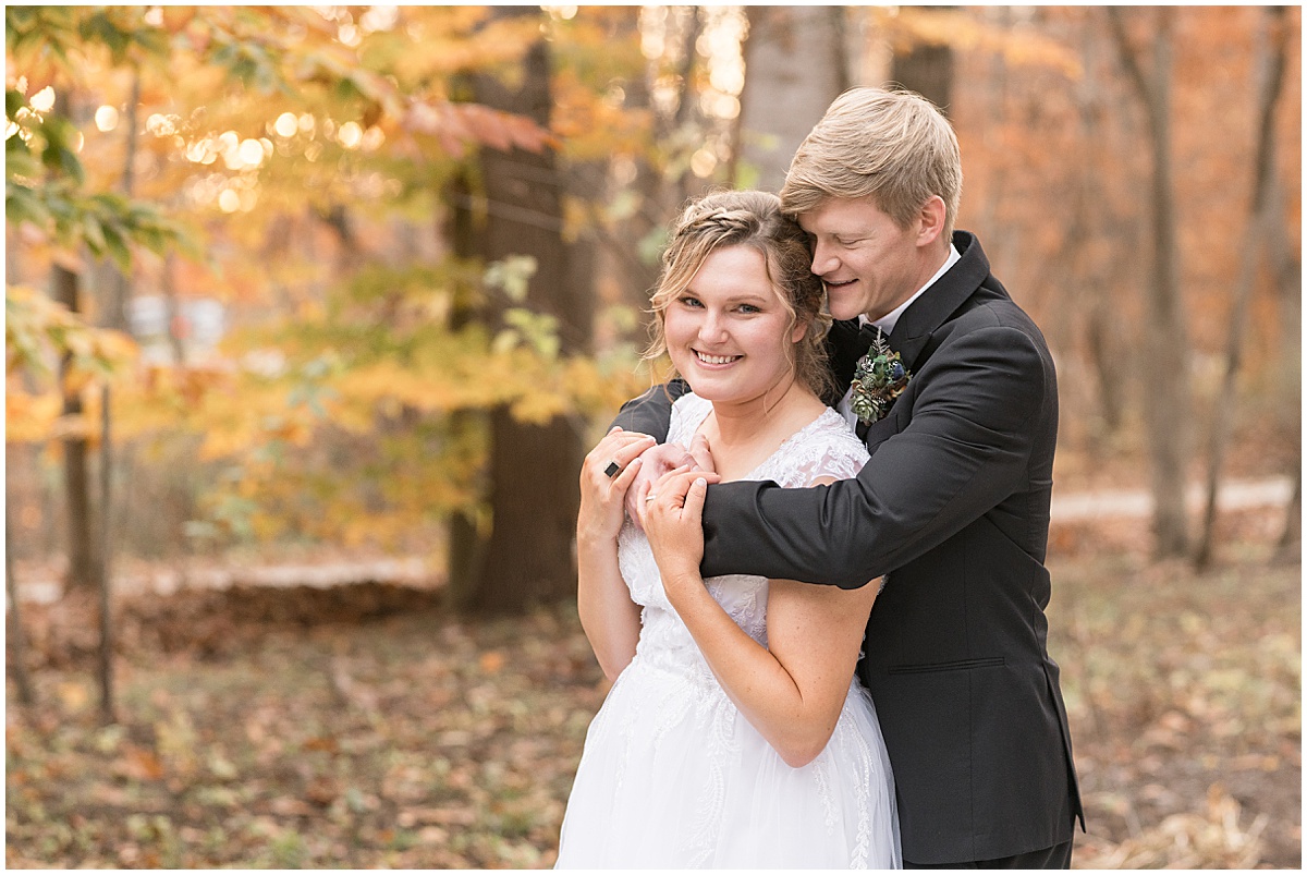 Bride and groom hug after fall wedding at 3 Fat Labs in Greencastle, Indiana