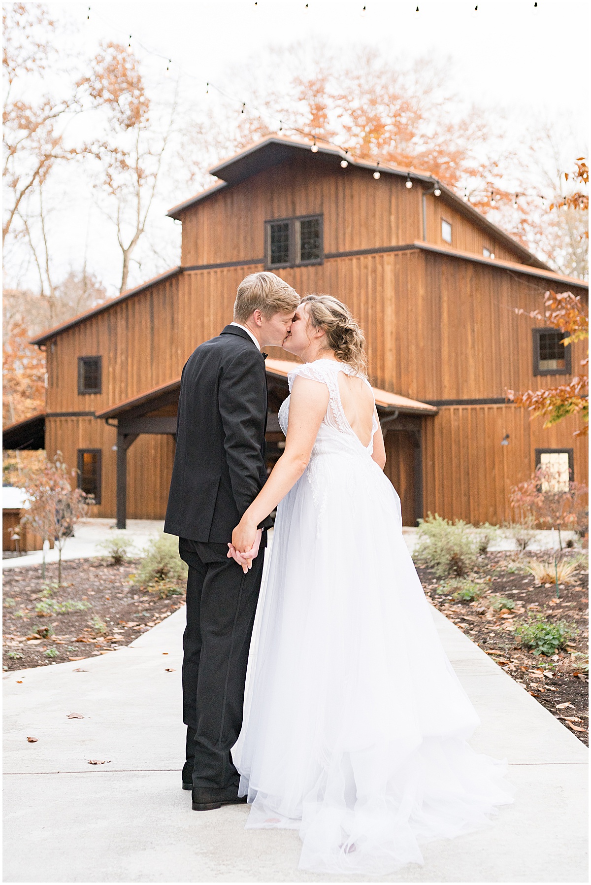Bride and groom kiss after fall wedding at 3 Fat Labs in Greencastle, Indiana