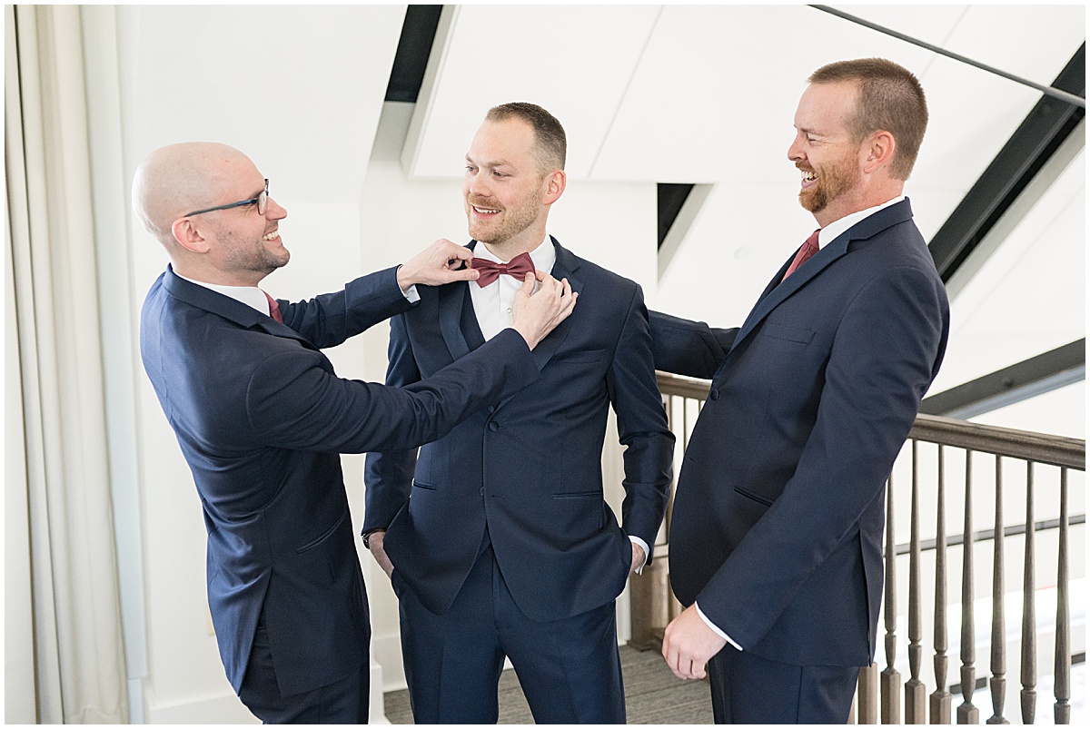 Groom with groomsmen getting ready for Iron & Ember events wedding in Carmel, Indiana