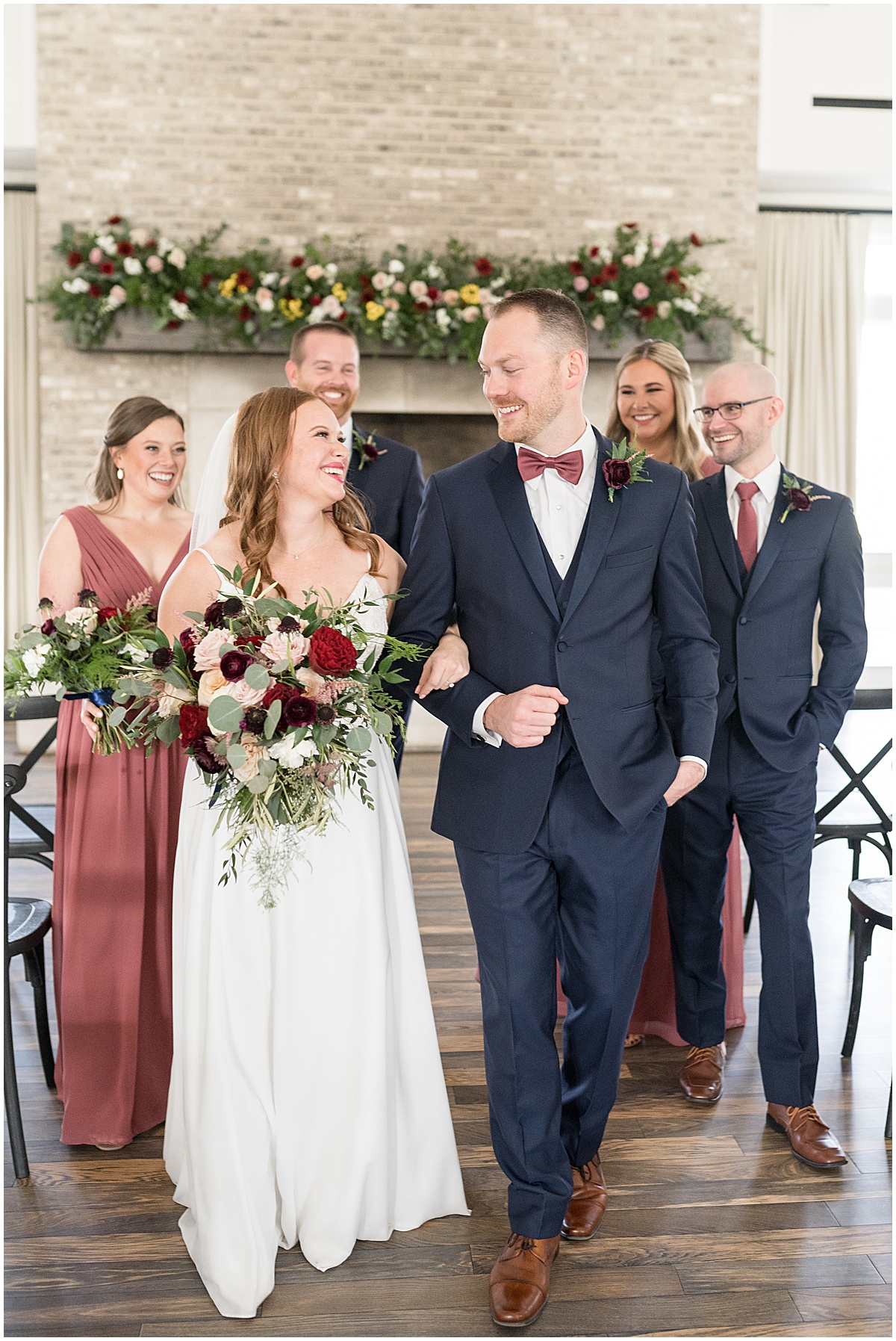 Bride and groom locking arms at Iron & Ember events wedding in Carmel, Indiana