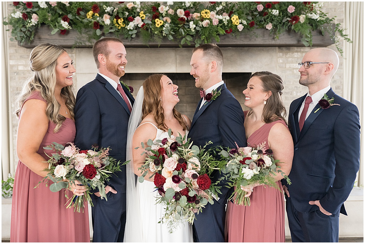 Bridal party laugh together at Iron & Ember events wedding in Carmel, Indiana