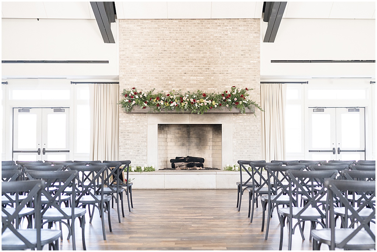 Ceremony location in front of fireplace at Iron & Ember events wedding in Carmel, Indiana