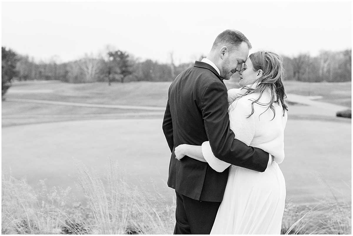 Newlyweds by golf course at Iron & Ember events wedding in Carmel, Indiana