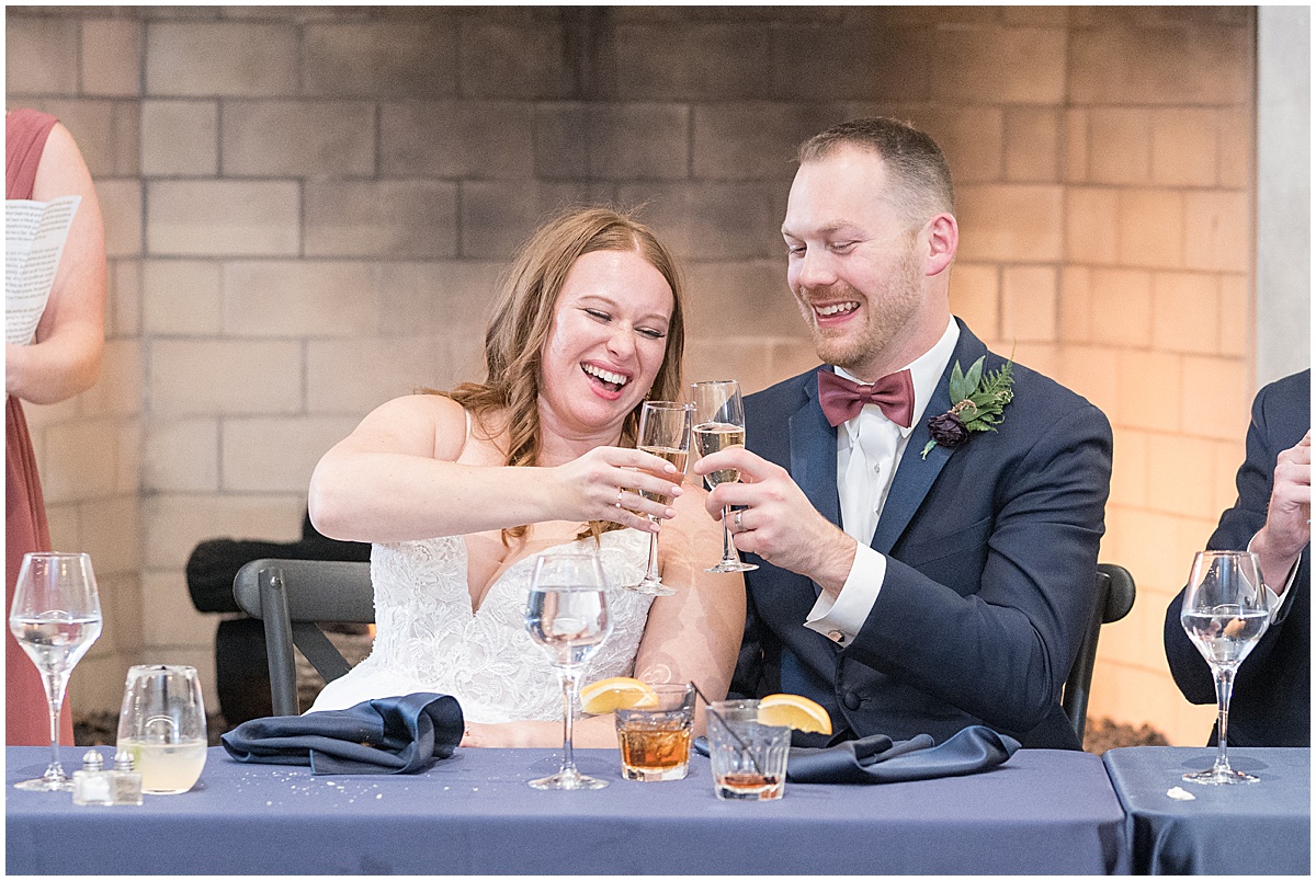 Bride and groom toast at Iron & Ember events wedding in Carmel, Indiana