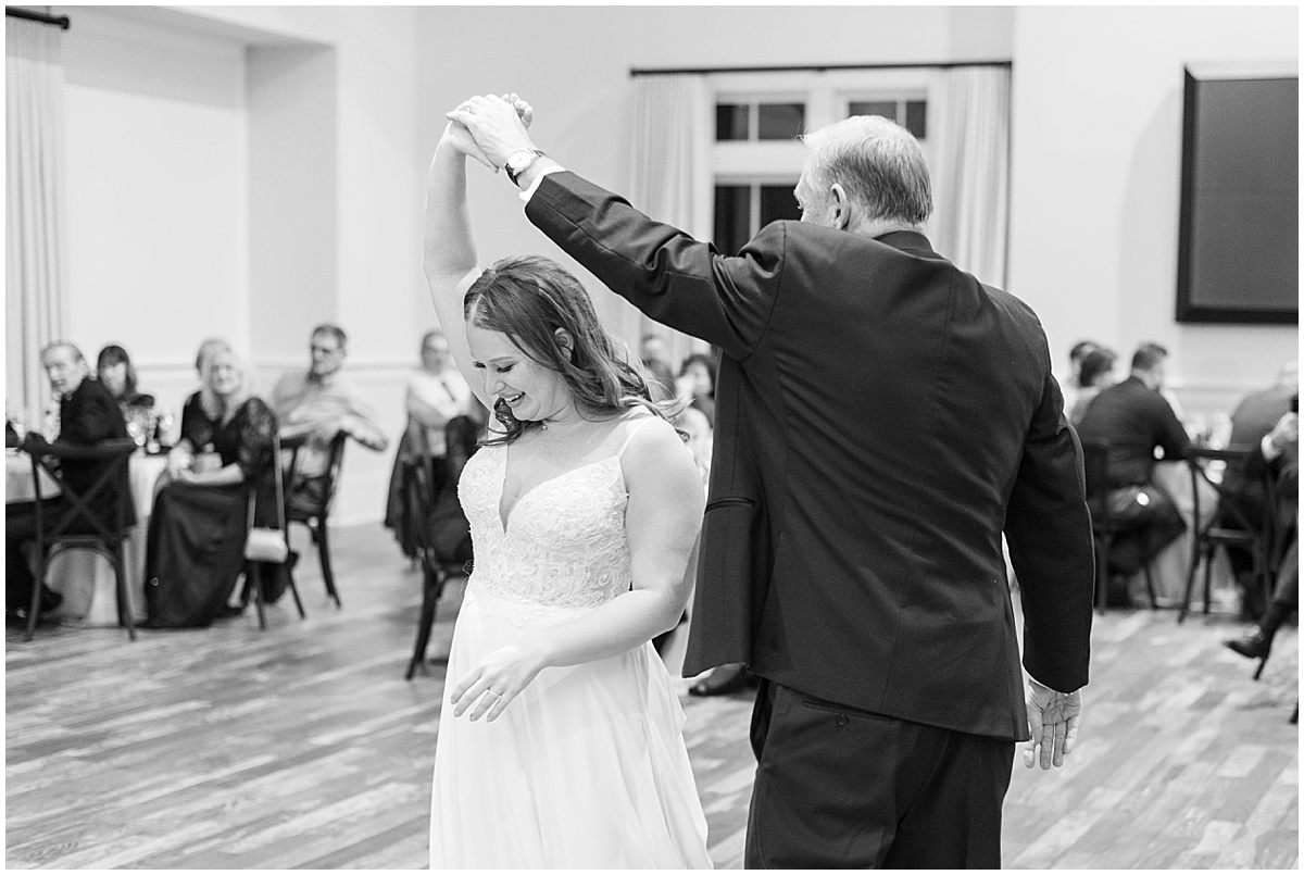 Bride dances with father at Iron & Ember events wedding in Carmel, Indiana