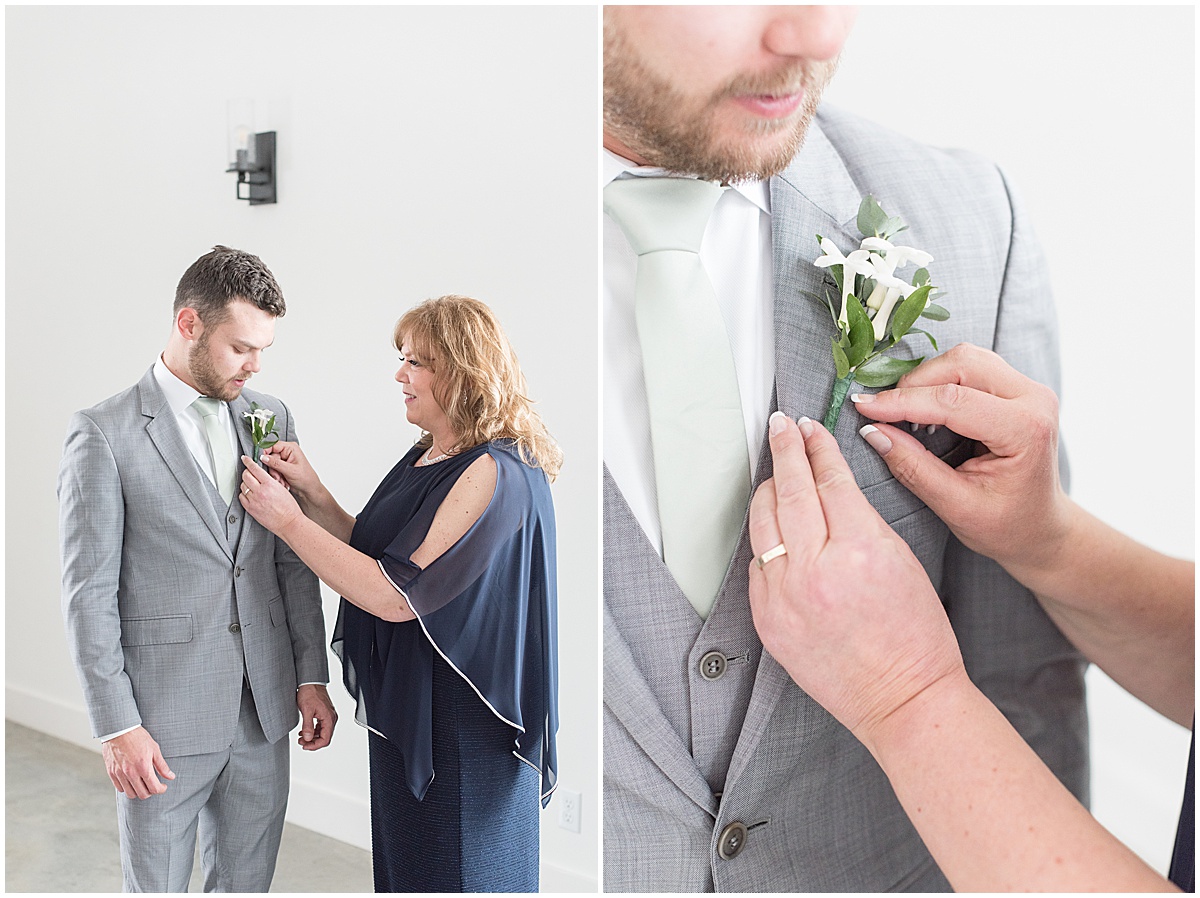 Groom has boutonnière put on for wedding at New Journey Farms