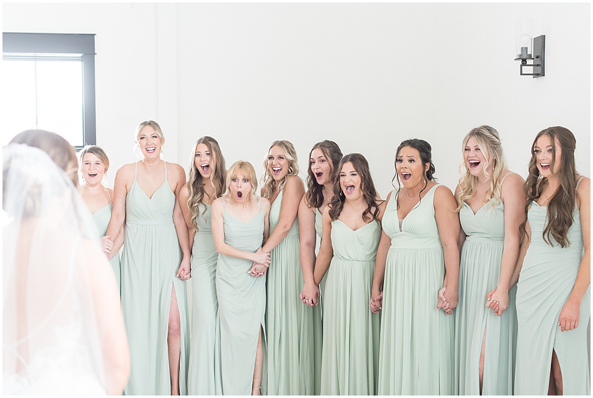Bridesmaids reaction to bride before wedding at New Journey Farms