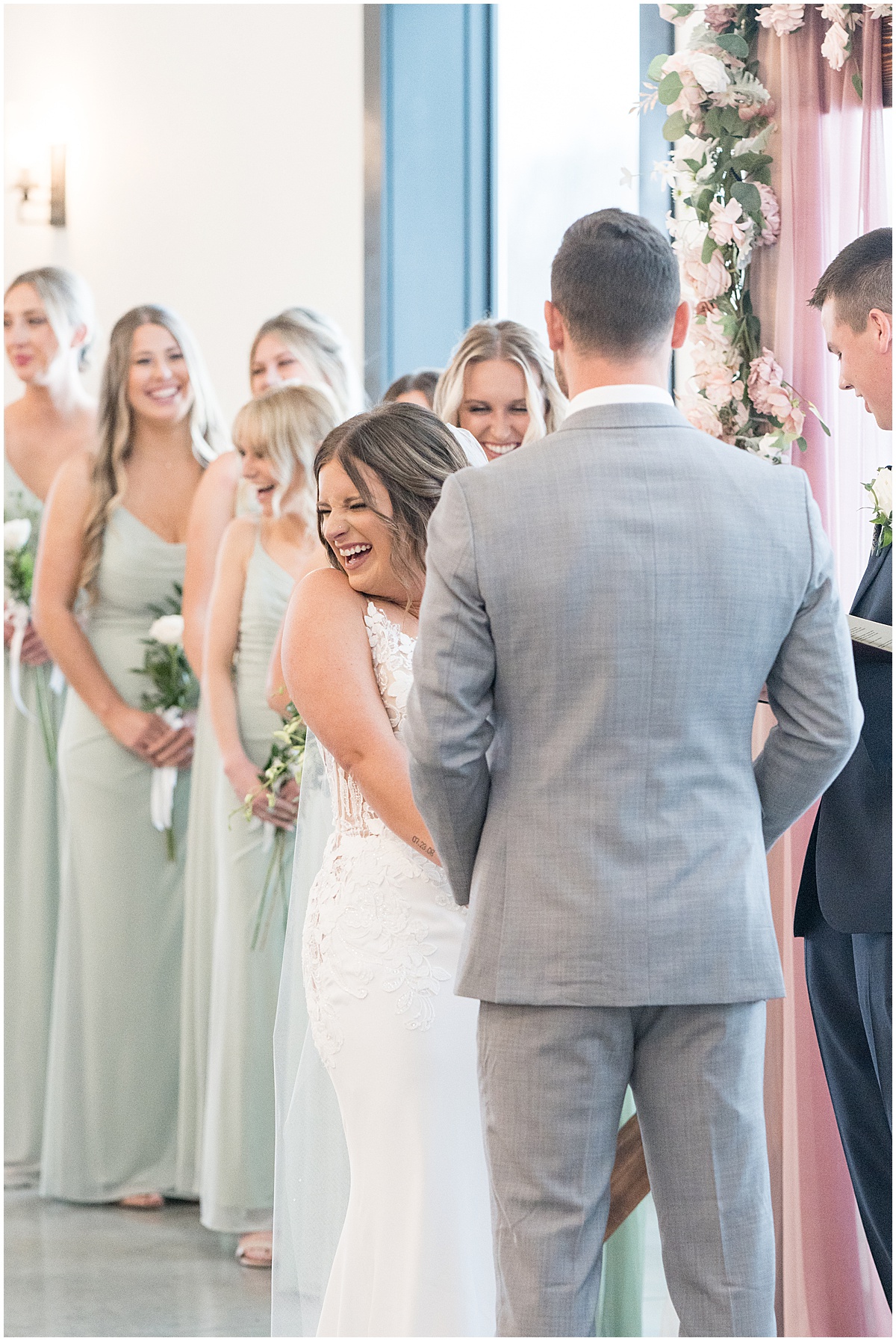 Bride laughing during ceremony at wedding at New Journey Farms