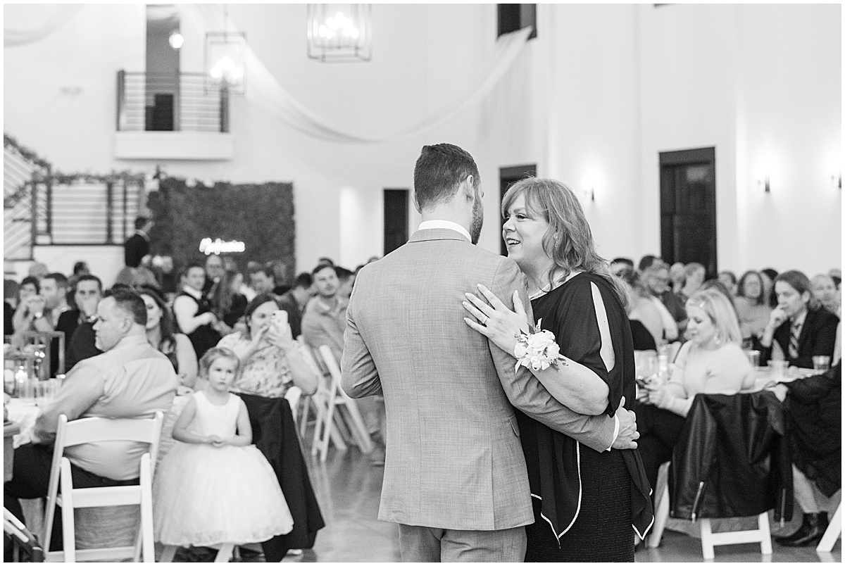 Groom dancing with mother during wedding at New Journey Farms