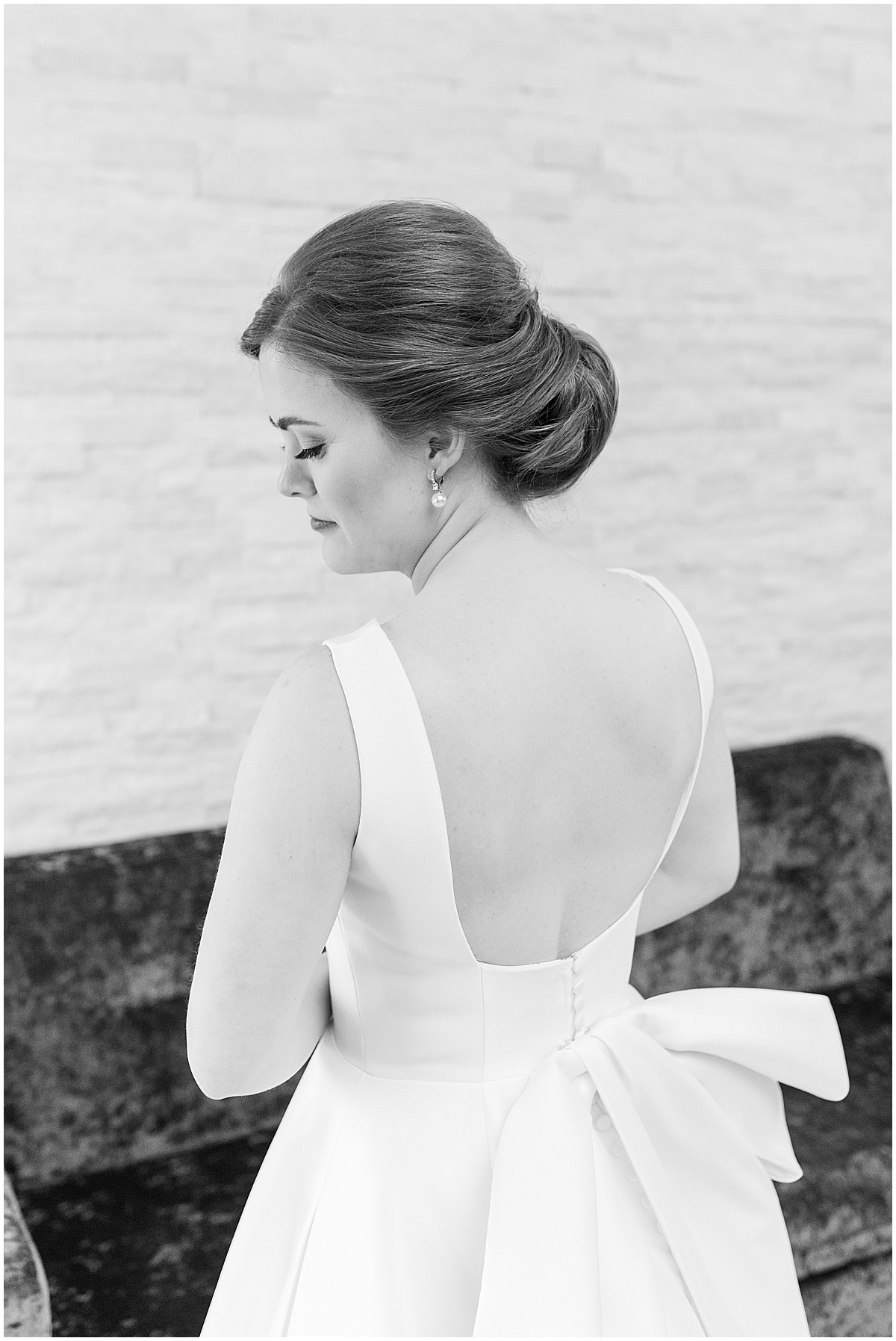 Bride showcasing back of dress for Allure on the Lake wedding in Chesterton, Indiana