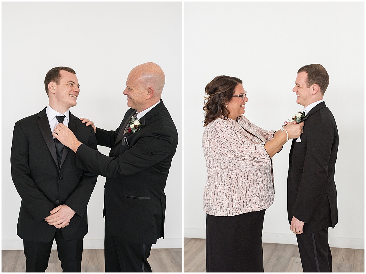 Groom getting boutonnière put on for Allure on the Lake wedding in Chesterton, Indiana