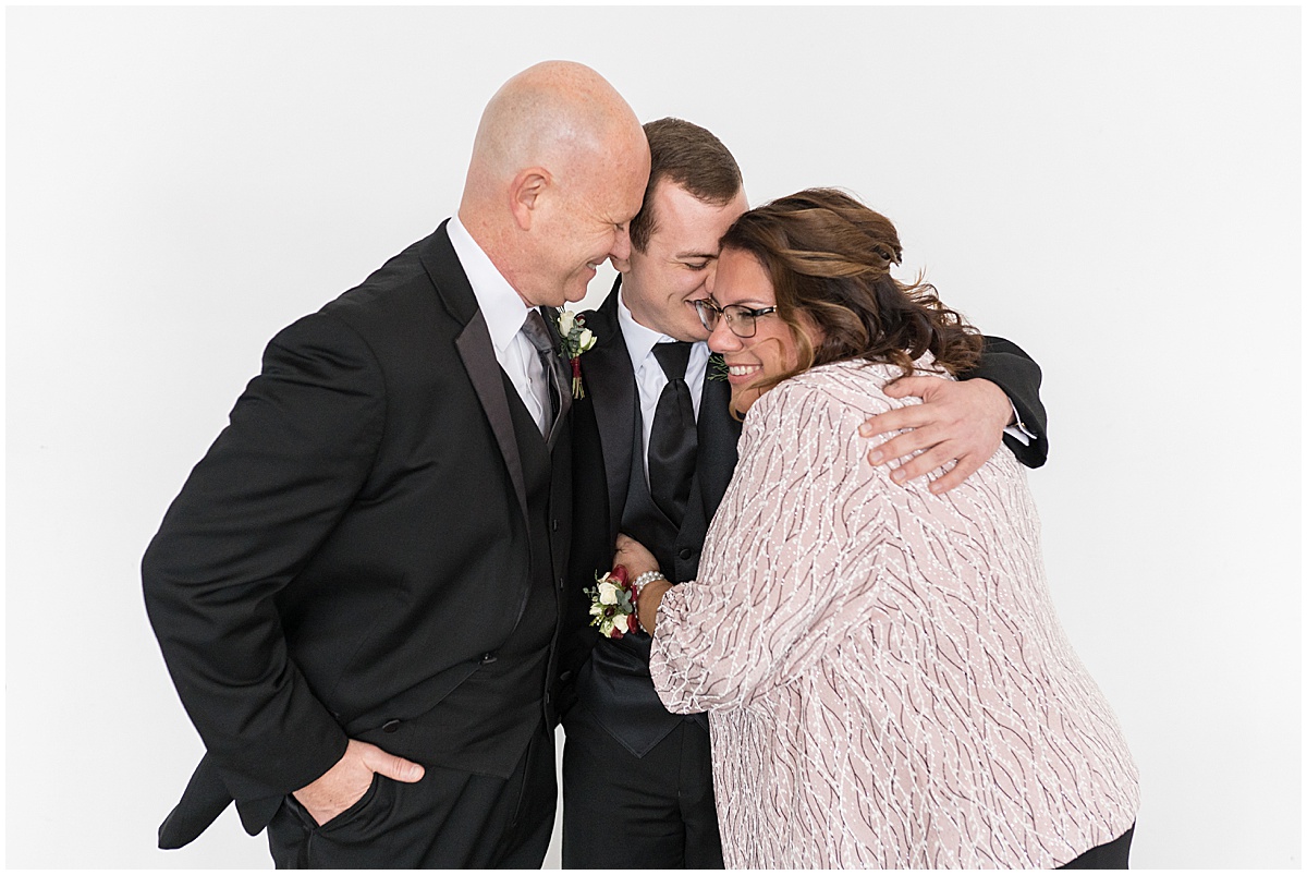 Groom hugging parents before Allure on the Lake wedding in Chesterton, Indiana