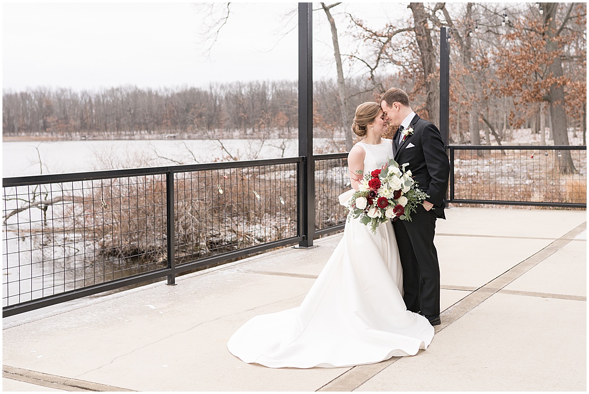 Bride and groom by lake before Allure on the Lake wedding in Chesterton, Indiana