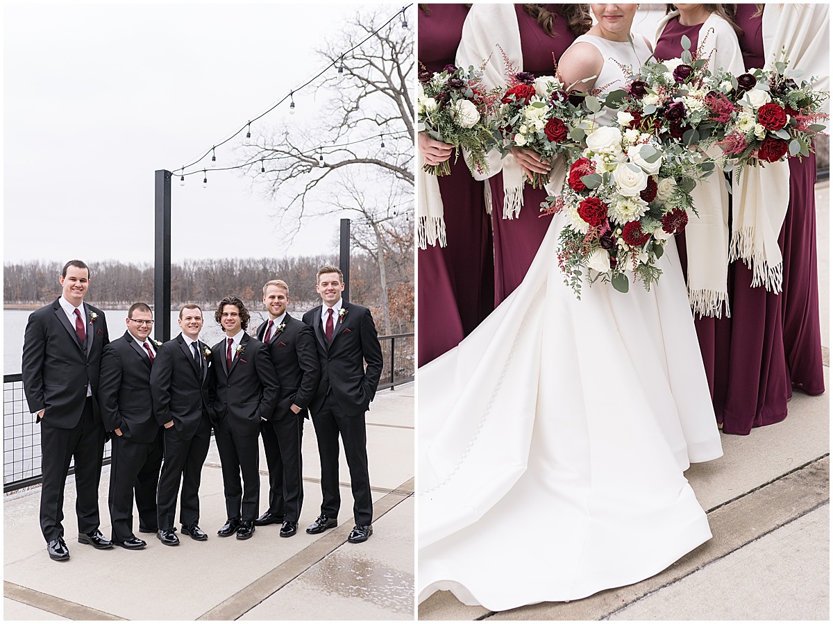 Groomsmen in black suits stand by lake at Allure on the Lake wedding in Chesterton, Indiana