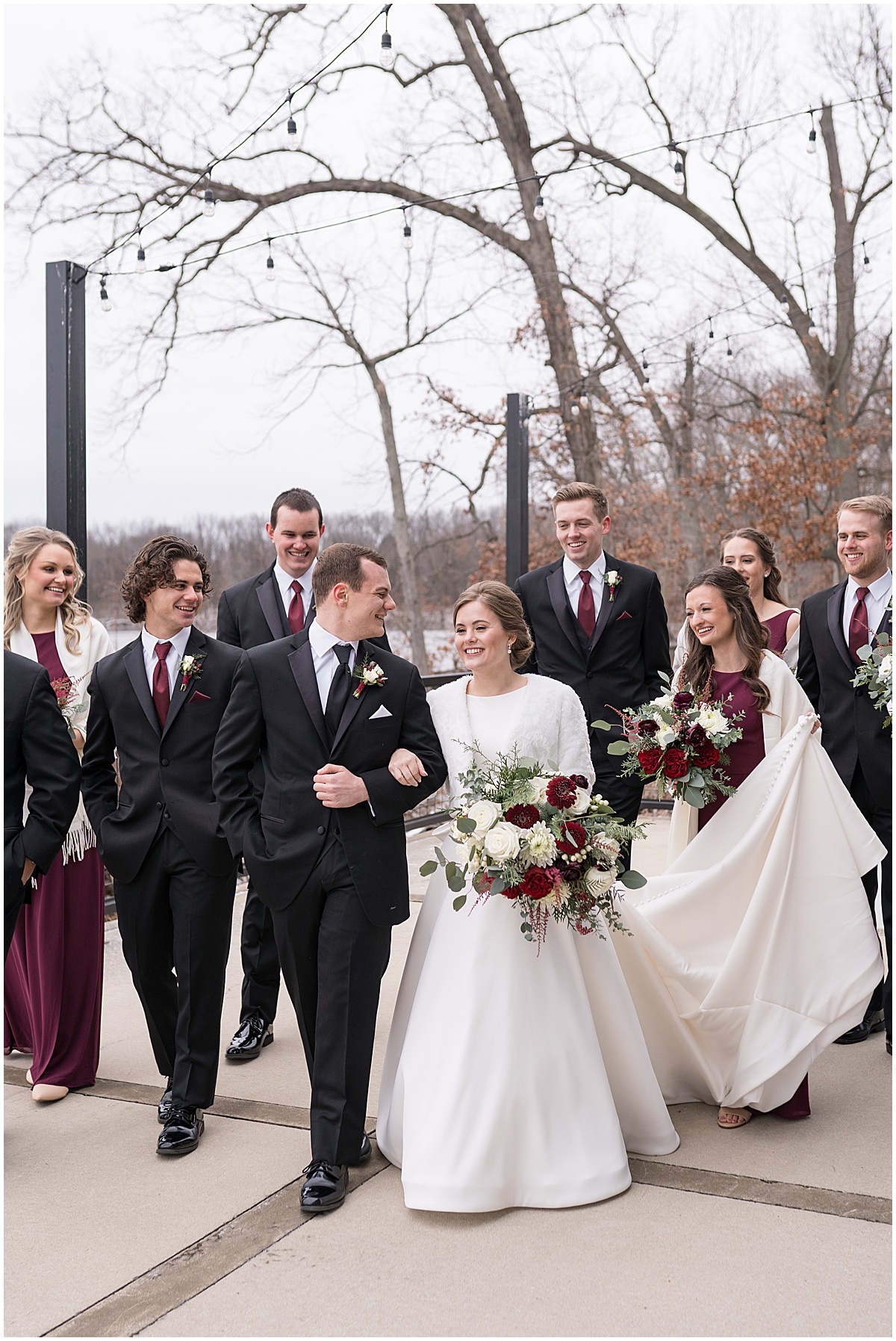 Bride and groom walk with bridal party at Allure on the Lake wedding in Chesterton, Indiana