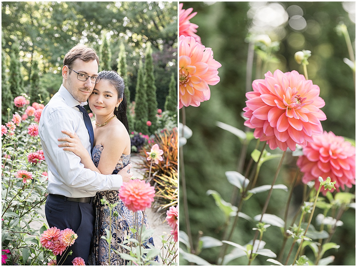 Couple hugs amongst pink flowers during garden engagement photos at Newfields in Indianapolis