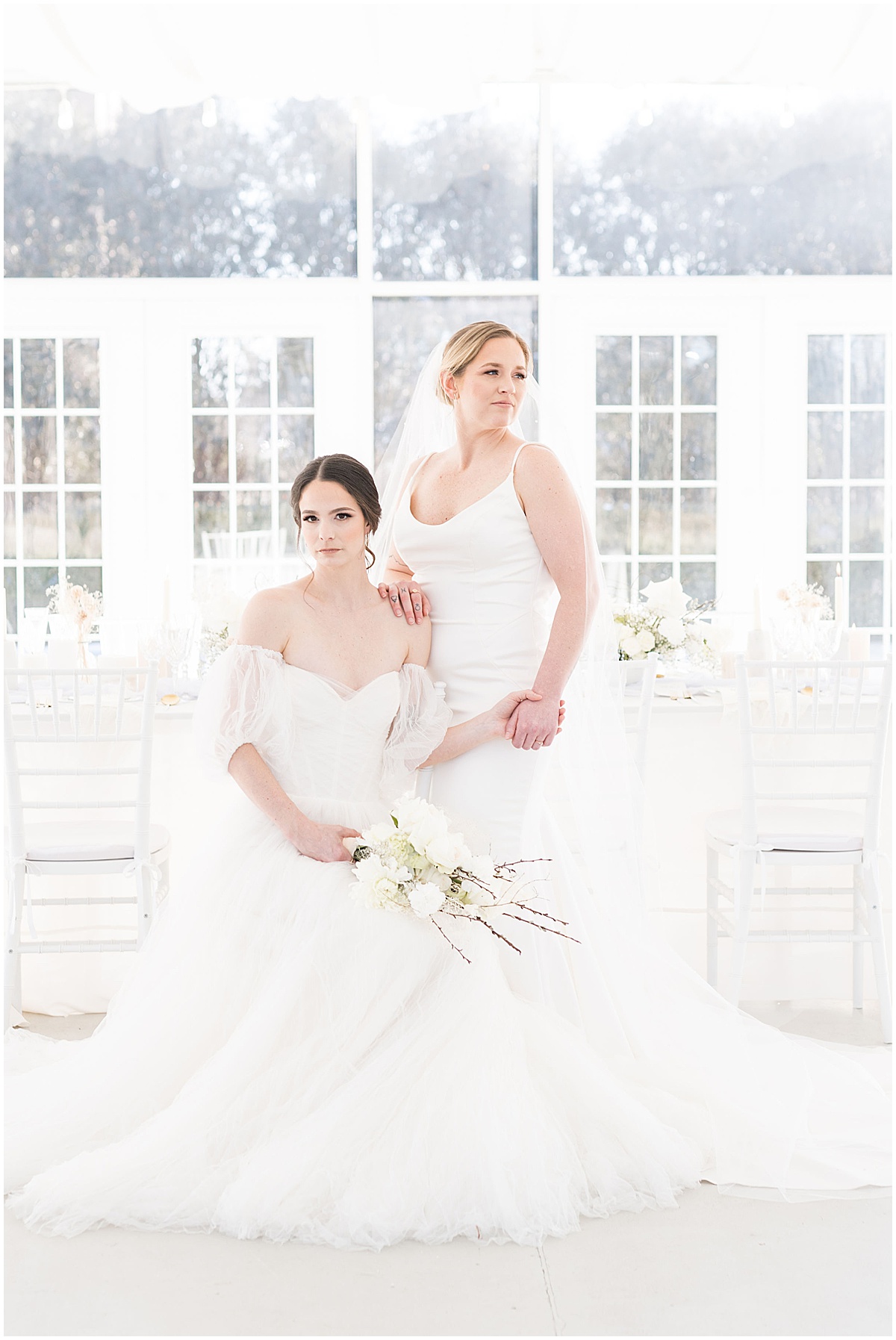 Brides holding hands after winter wedding at The Ritz Charles Garden Pavilion in Carmel, Indiana photographed by Victoria Rayburn Photography